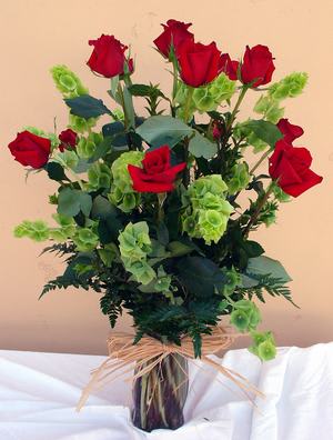 Dozen roses with Bells of Ireland in standard vase