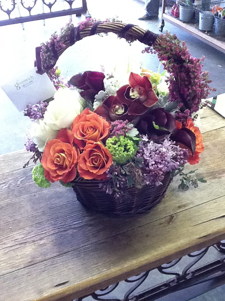 a new twist on a floral basket with
velvet ribbon, orchids, lilac, roses