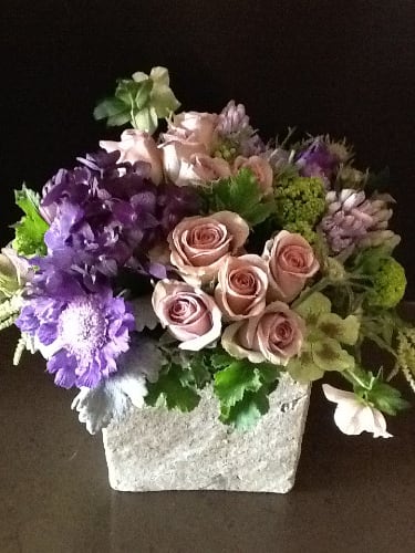 premium floral tightly displayed in stone cube
