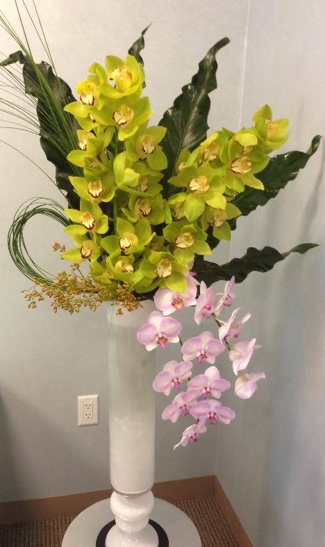 Cymbidium &amp; Phaleonopsis Orchids Accented with steel grass, tropical leaves &amp; seeded