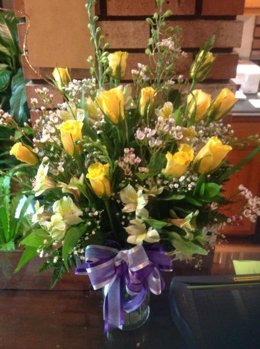 A Dozen Yellow Roses with accent flowers (varies), sparkly curly ting in