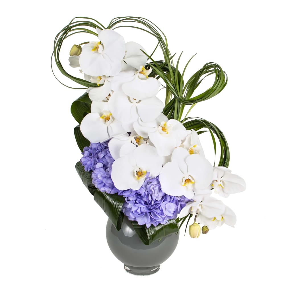 Spring Splash is an amazing arrangement with phal orchids and lush hydreangea