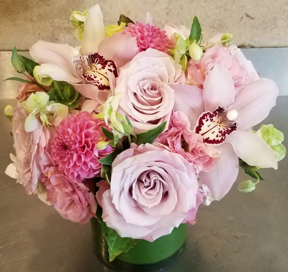 pink roses, cymbidium, lisianthus and other seasonal flowers