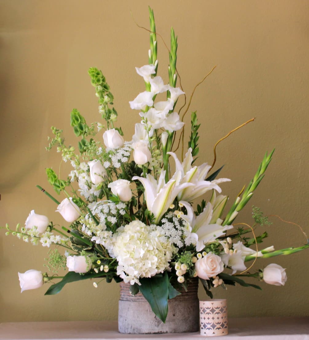 all with sympathy arrangement,.Gladiolus, Roses, Casa Blanca lily&#039;s, queen Ann lace, bells