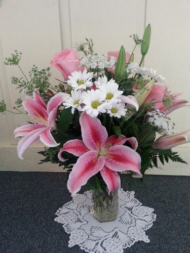 pink lilies and roses with white accents - vased 