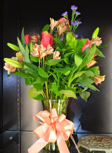 Cherry Roses, Asiatic Lilies, Alstro, Purple Monte and more in this bright