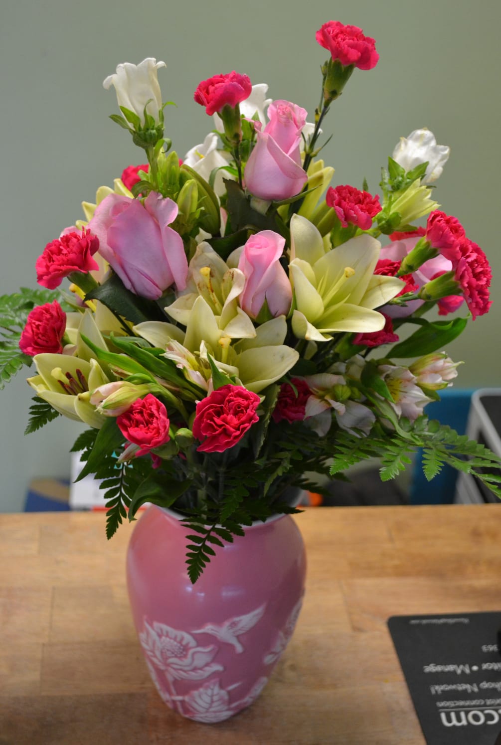 This stunning arrangement has pink roses, alstro, mini carnations, lilies, campanula and