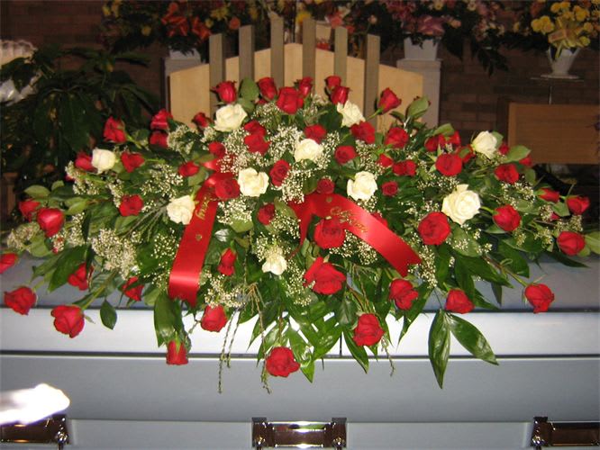 All roses full casket spray. Can be customized with different color