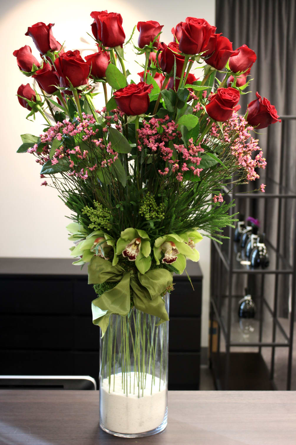 Red Roses and Green Orchids in Glass Cylinder Vase