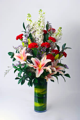 mix arrangement with stargazers in vase
