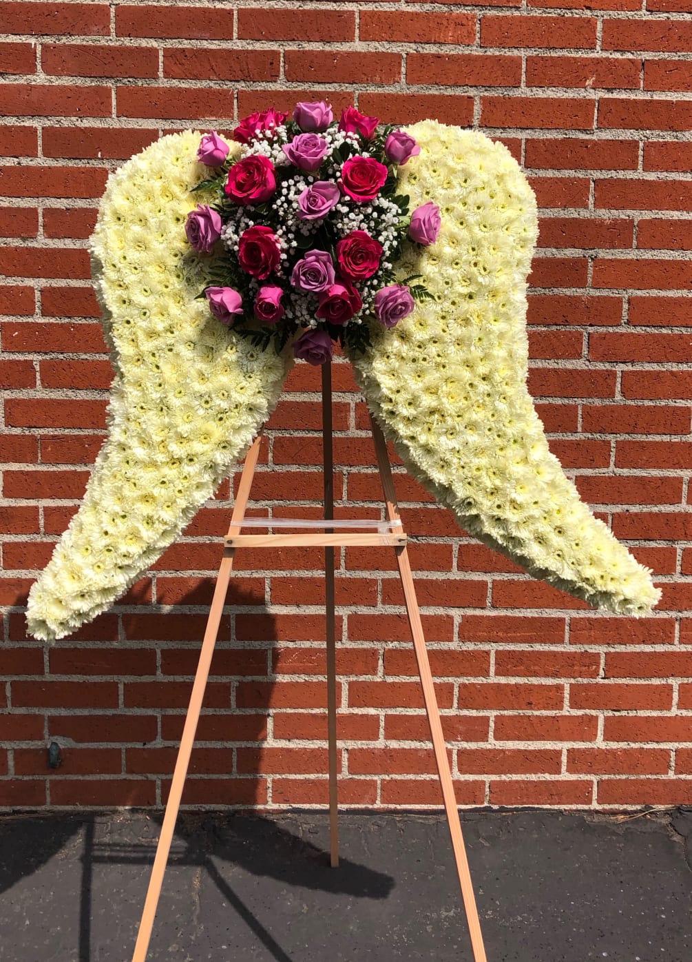 Large angel wings with roses, pom pom , leather and babies breath