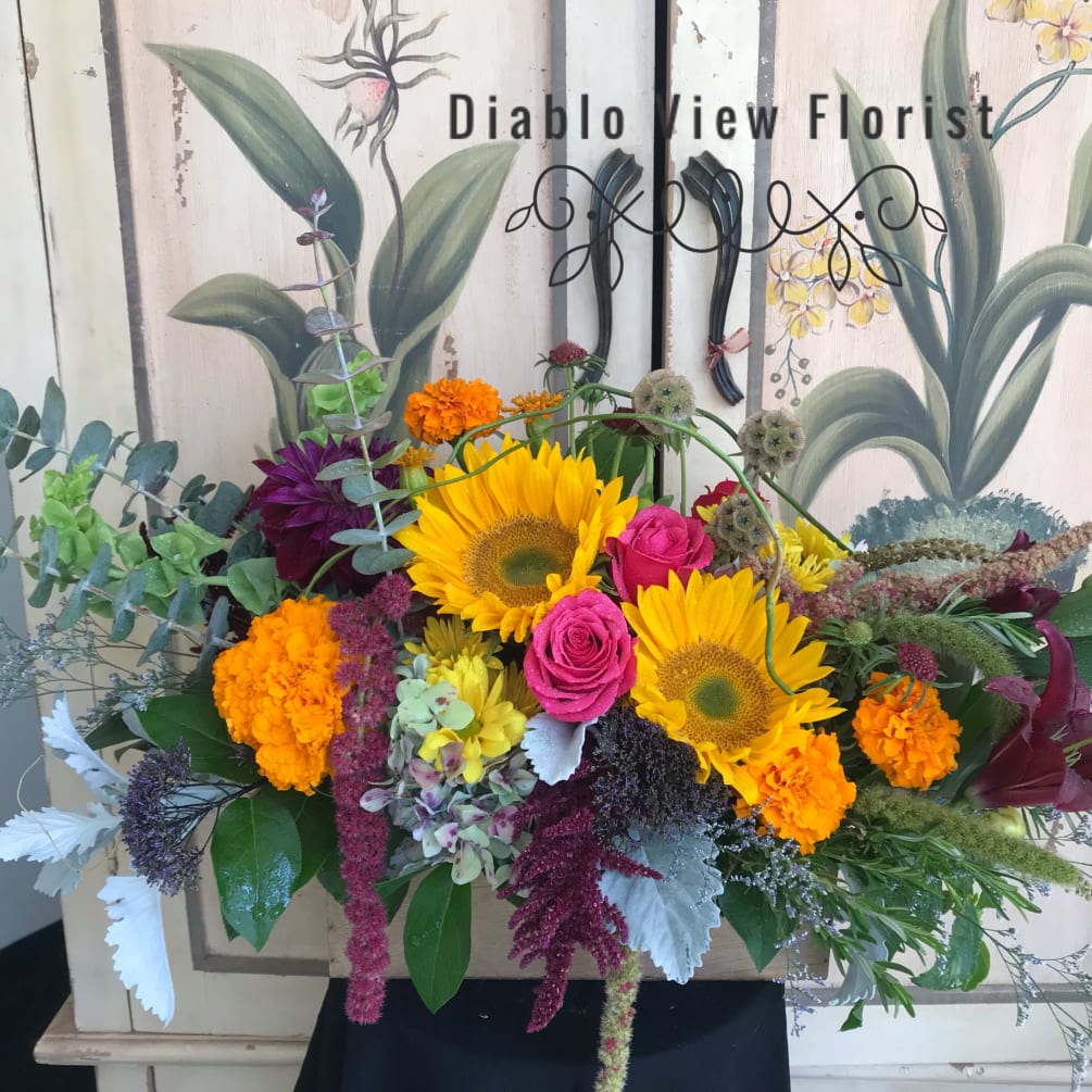 This bouquet offers the visual splendor of all things farm grown. These