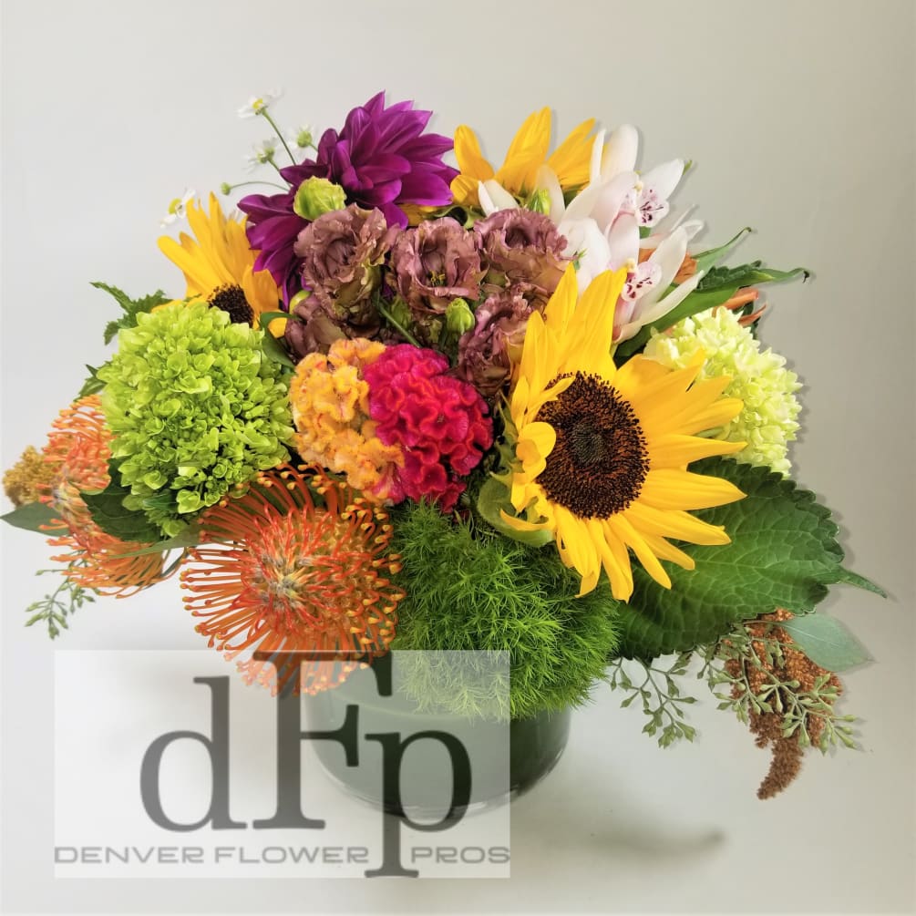 A bright and happy spring arrangement with interesting spring flowers and Some