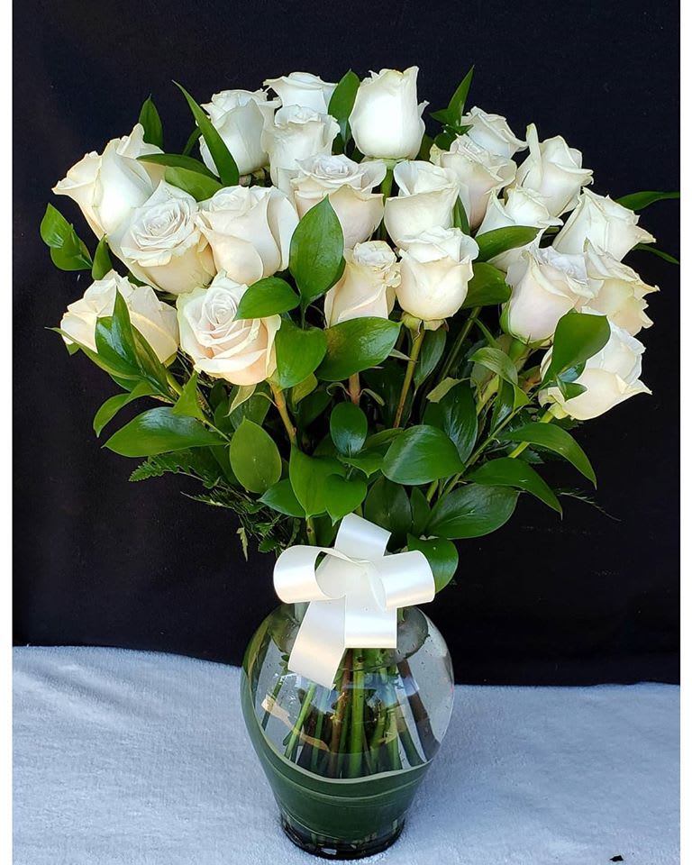 Our pristine white roses are an elegant surprise for someone who brings