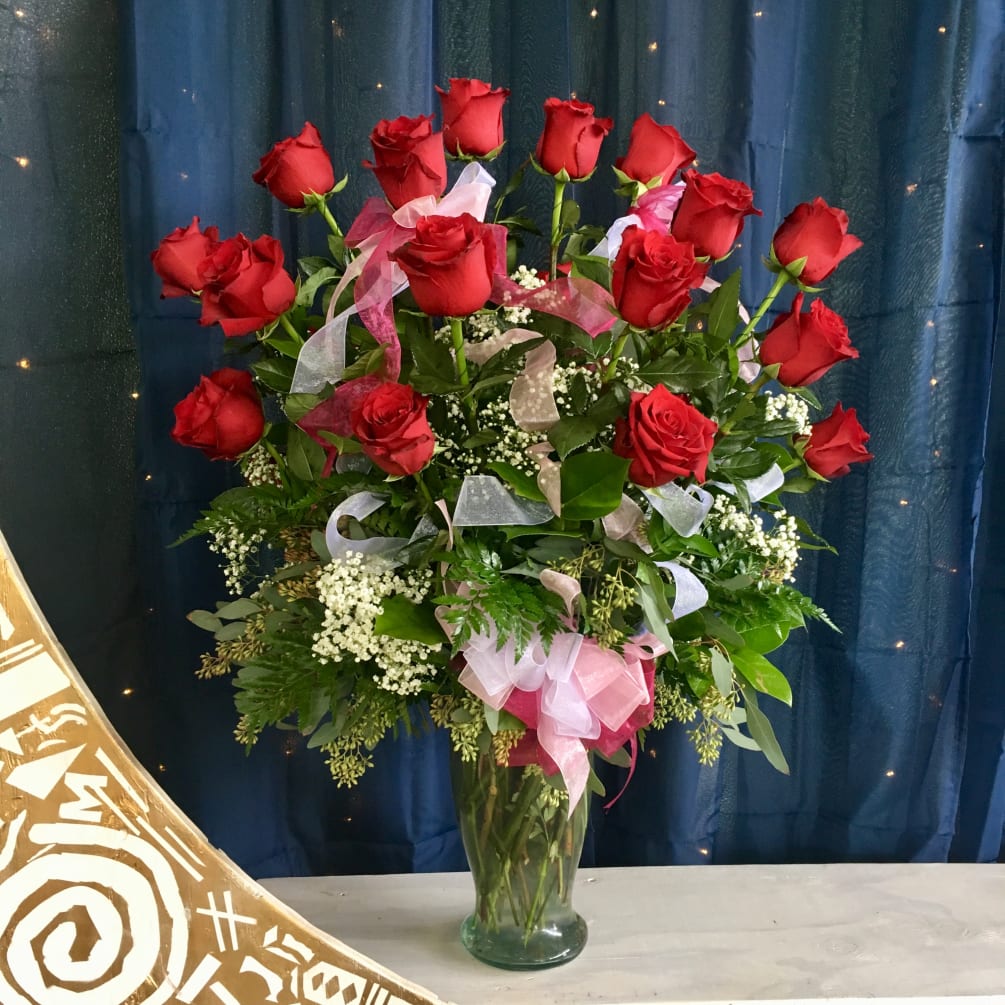 Two dozen premium, long stem roses put on a breathtaking display for