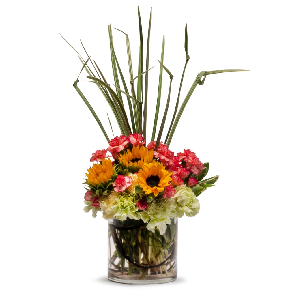 Sunflowers and carnations in bright colors make this a bouquet of happiness!
Approximately