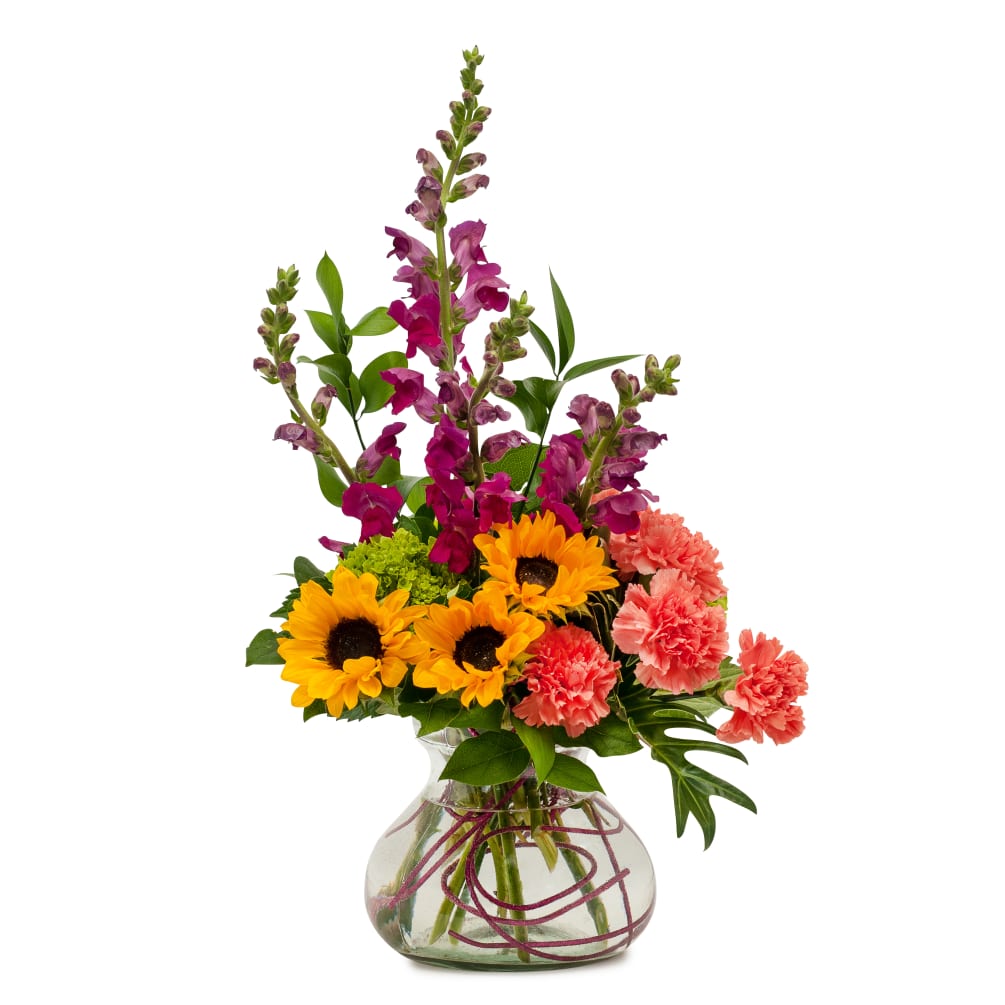A bright pleasing combination of cheerful flowers.	
Approximately 12&quot;W X 16&quot;H