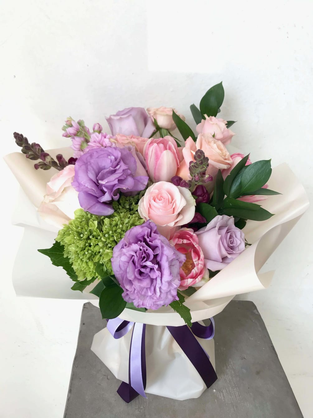 Mixed bouquet of pink Roses, lavender Lisanthus, lavender and peach roses, lavender