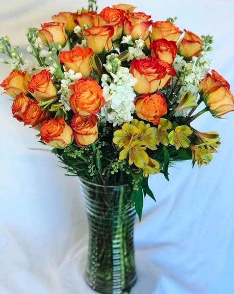 All things tropical and bright with this arrangement.
This arrangement blooms in our