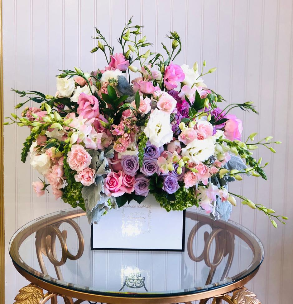 This Chocolato arrangement is made with dendrobium orchids, phalaenopsis orchids, pink and