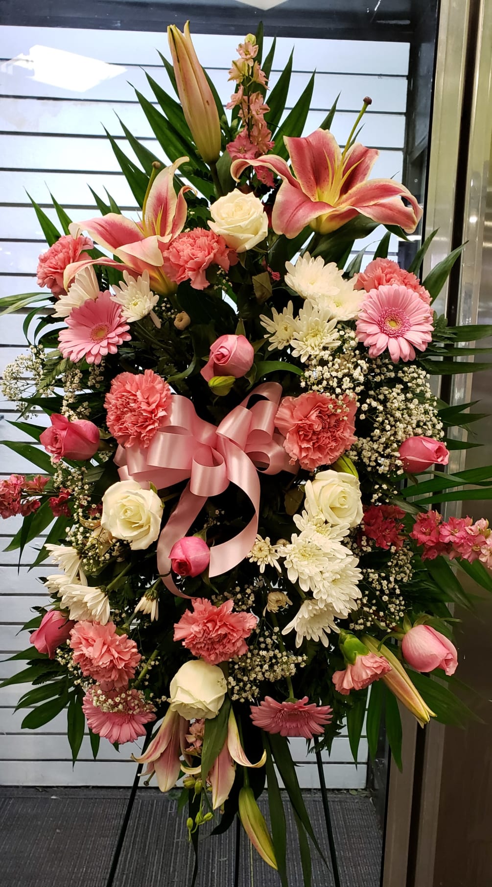 This gorgeous pink and white standing spray is a great way to