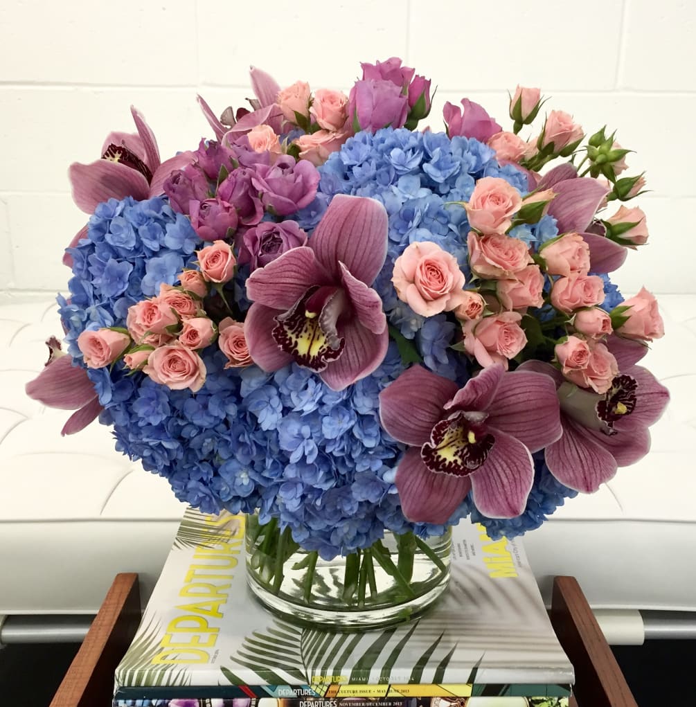 This Stunning Arrangement is filled with Blueish Purple Hydrangea, Summer Plum Cymbidium