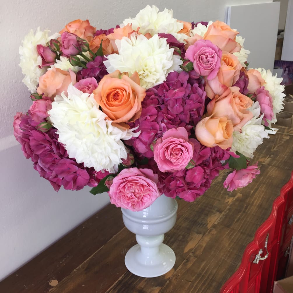 This Extra Large arrangement is filled with raspberry hydrangea and garden roses