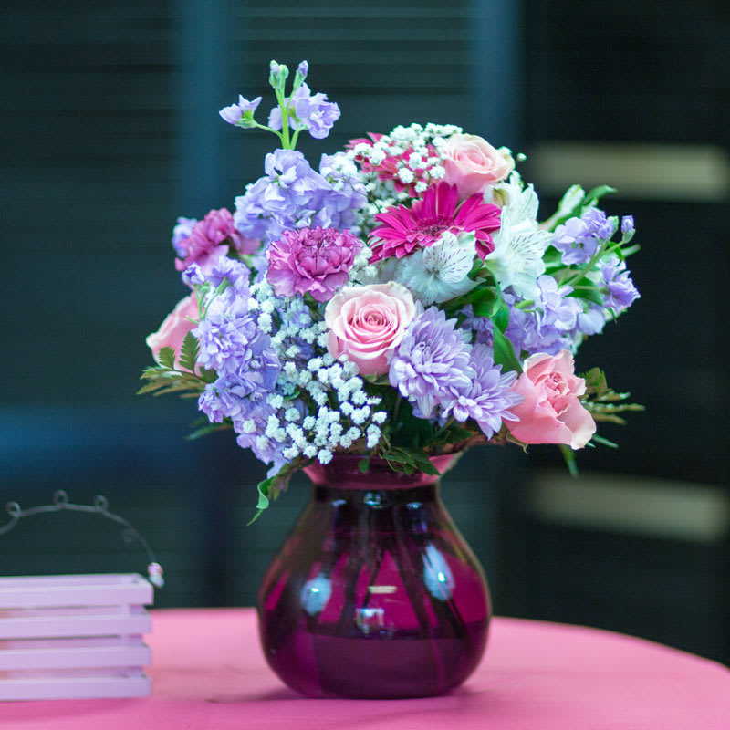 Beautiful  full and showy pink roses, lavender poms, stock and white