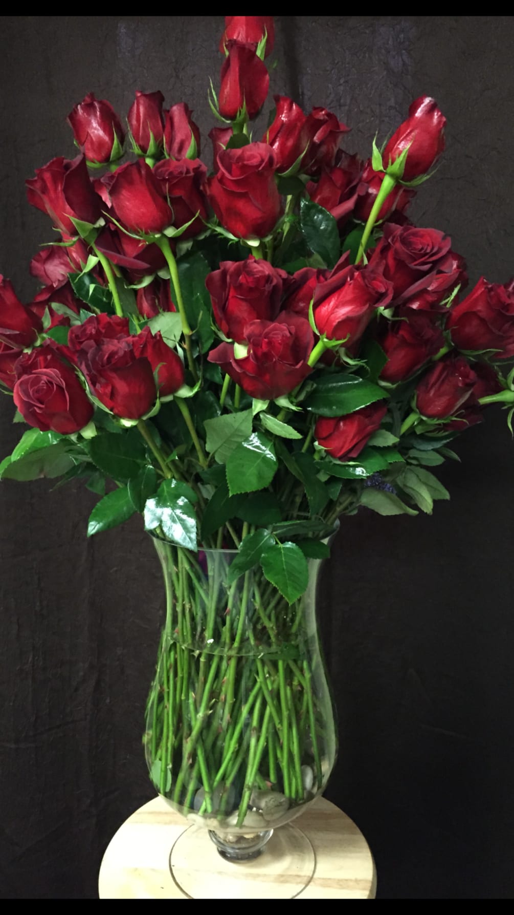 100 red roses by Laurie Anne's House of Flowers