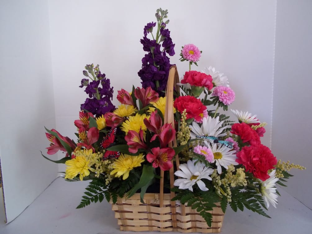 spring flowers make this basket bloom into summer.  Stock. carnations and