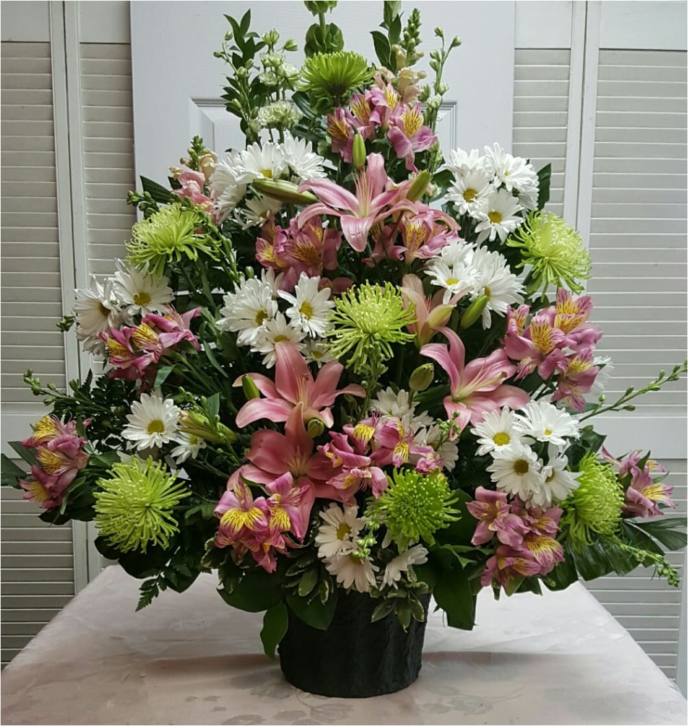 This Traditional Funeral Spray with Spring Colors consists of Pink Lilies, Snapdragons