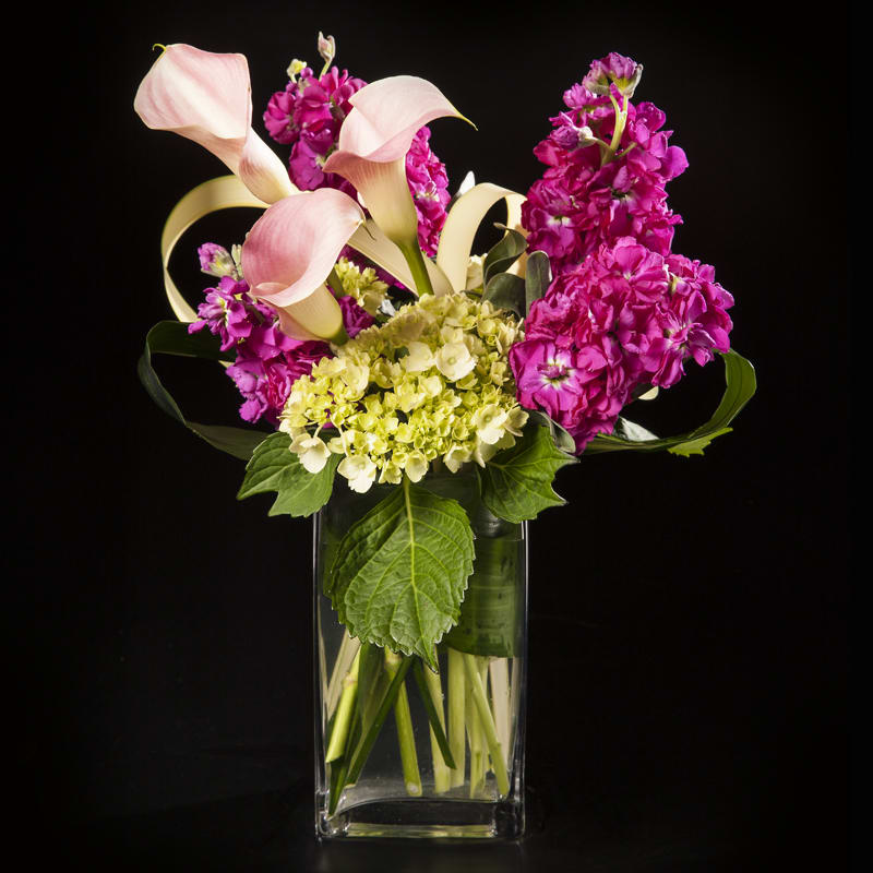 A gorgeous combination of mini calla lilies, fragrant stock and mini green