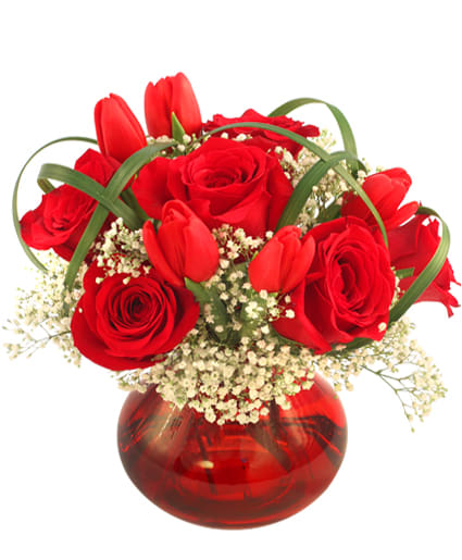 5&quot; ruby vase (subject to availability)
foliage: lily grass
6 red roses
5 red tulips
4