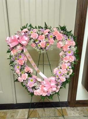 this one is done is pink and lavender with carnations and daisies.