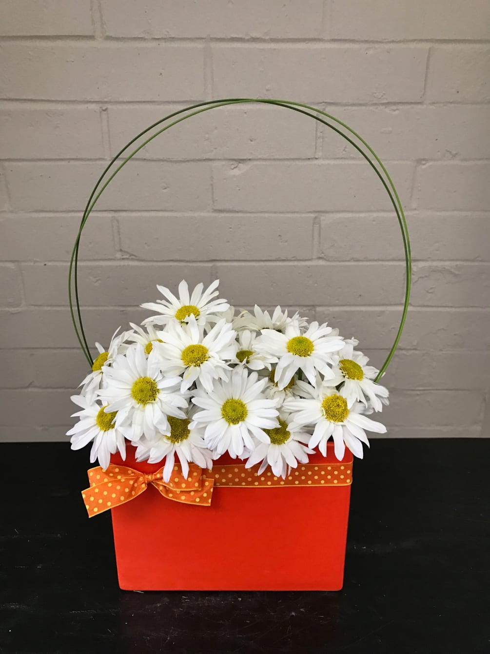 Cheerful and Fun Daisy arrangement in colorful ceramic vase.