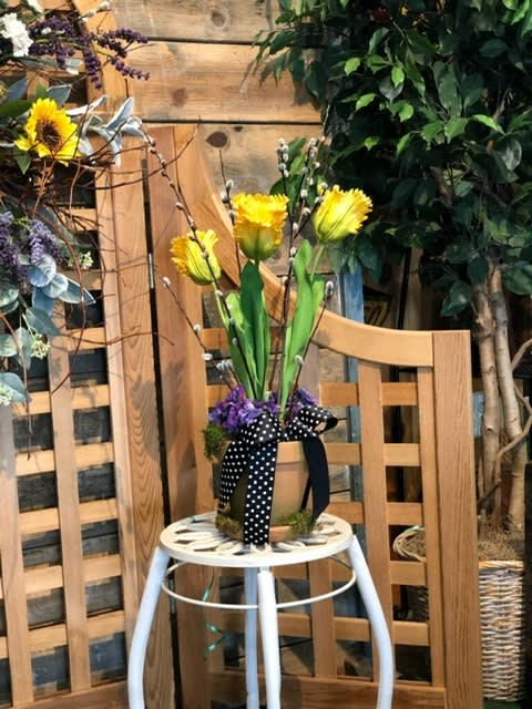 Claudia OHara beautifully designed a clay pot with yellow, real touch tulips.
