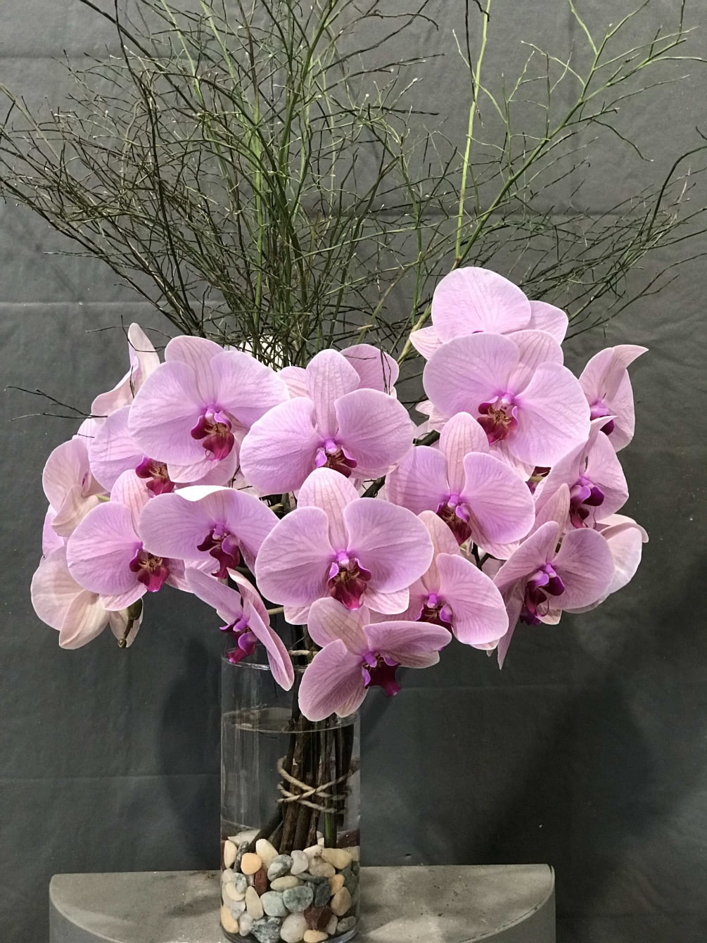 Cut stem orchid arrange in vase by Divine Orchids