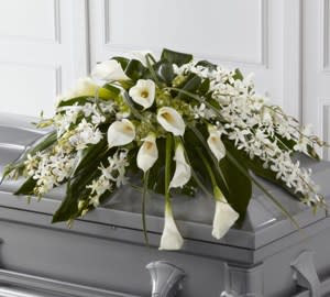 Elegant in all white, calla lilies, dendrobium orchids, tropical leaves.  Script
