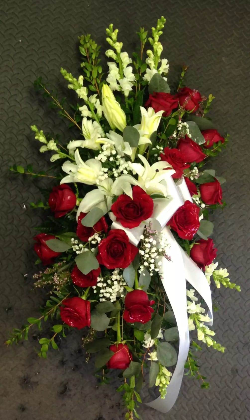 Red roses and any White flowers of your choosing
