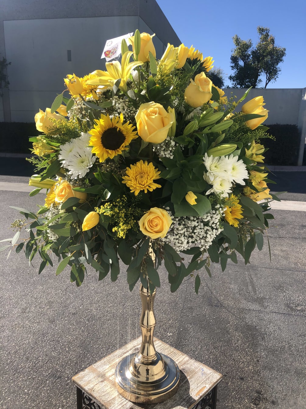 22” gold vase stand w/ yellow and white floral by Casa Blanca Flowers