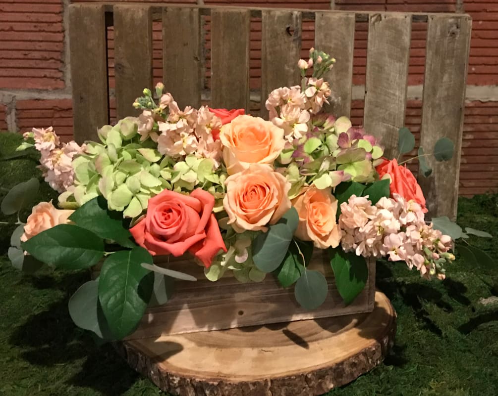 This classic arrangement featured in a wooden box includes a mix of