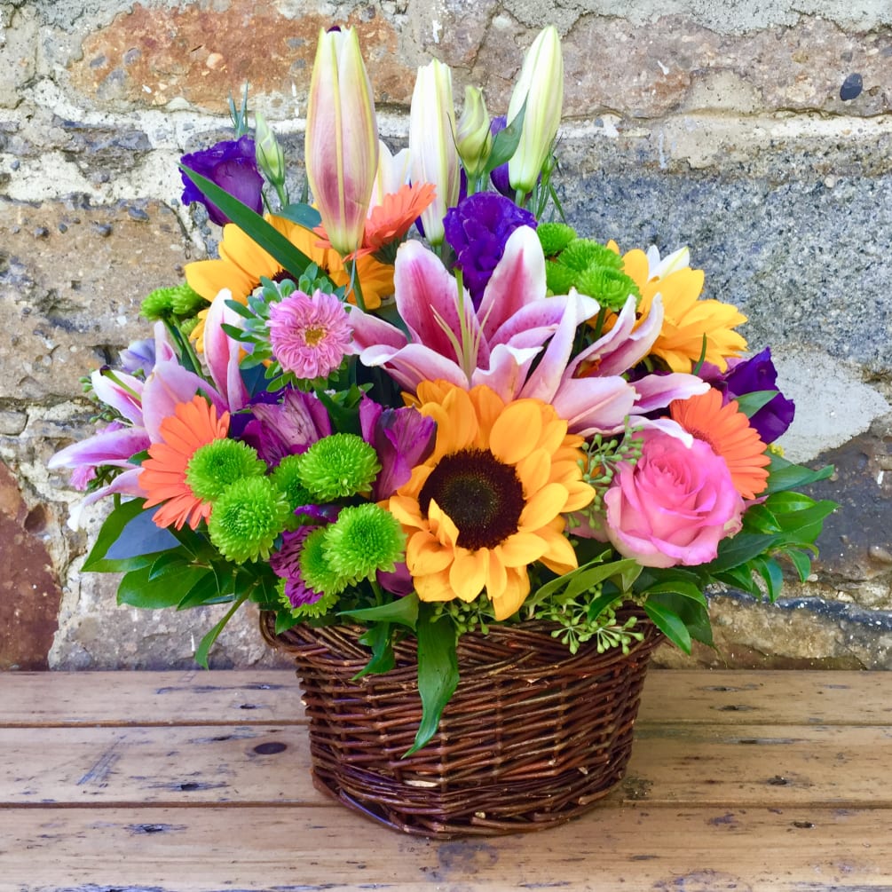 A vibrant mix of flowers guaranteed to make you smile.  Sunflowers