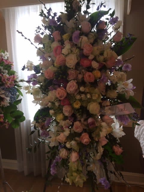 Beautiful blend of roses and accent blooms, custom designed with your colors