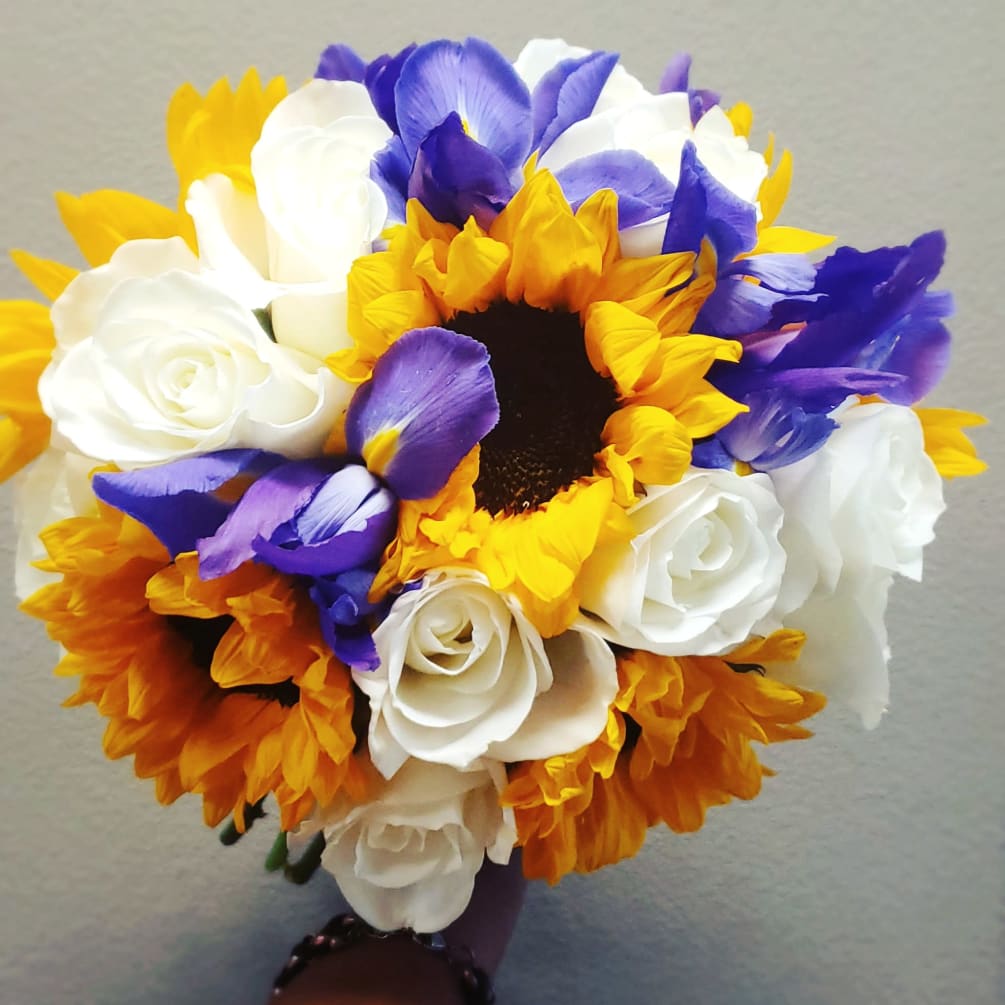 Sunny bouquet with vibrant Sunflowers, blue Irises and white Tibet Rose&#039;s. 