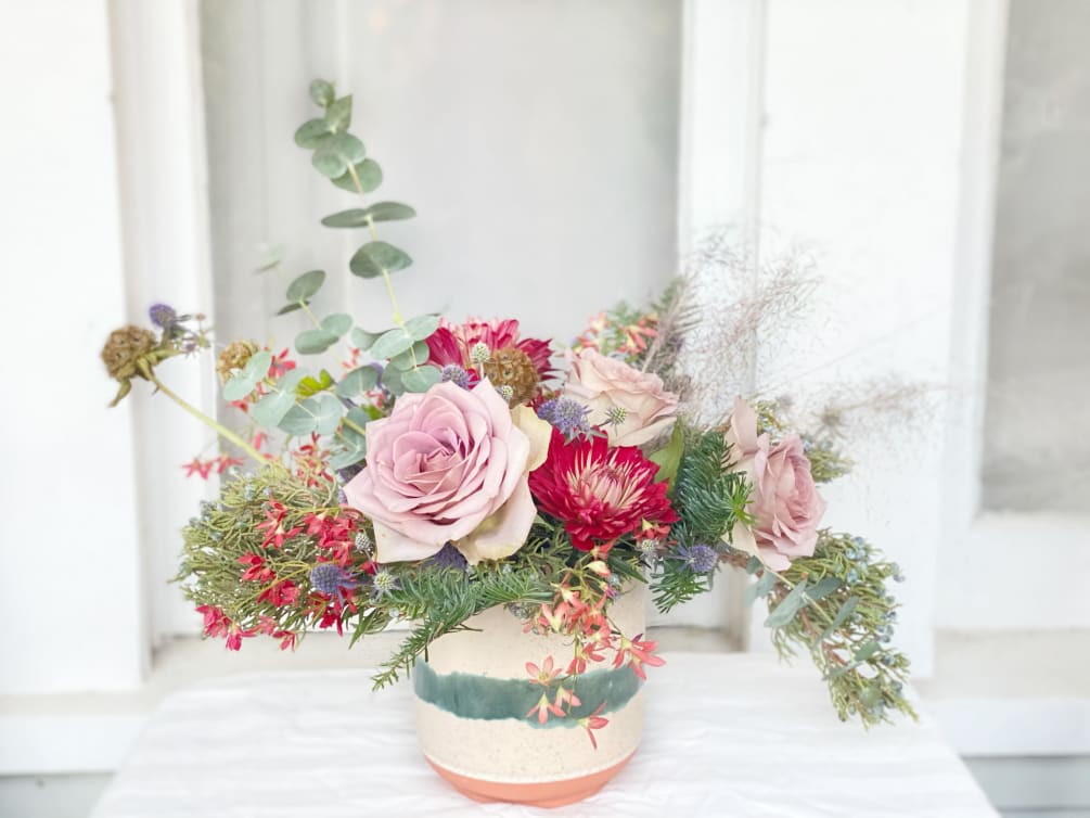 This holiday arrangement is inspired by the organic, natural beauty of the