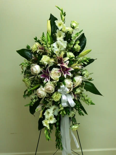  Spray is an all white and cream colored funeral piece with