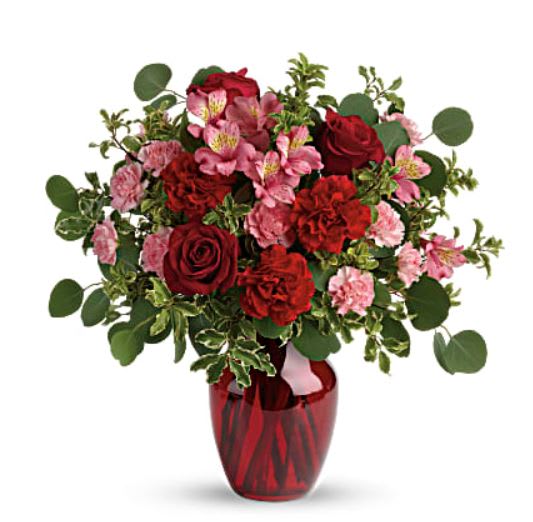 Tres belle! Ruby red roses and delicate pink alstroemeria are mixed with