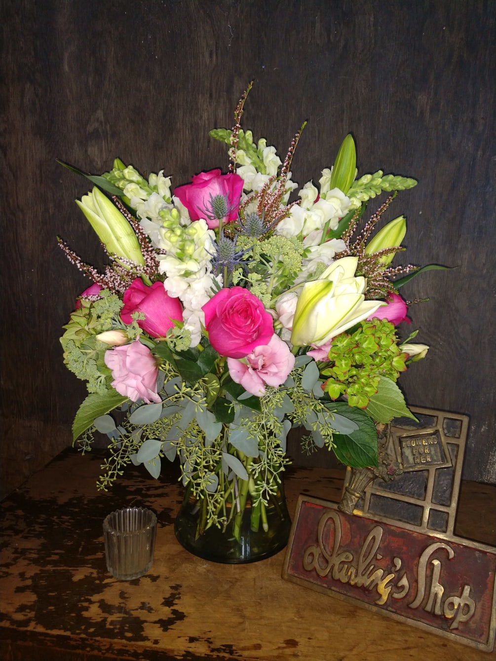 Featuring hot pink roses, pink Lisianthus, lilies, green hydrangeas and more. A