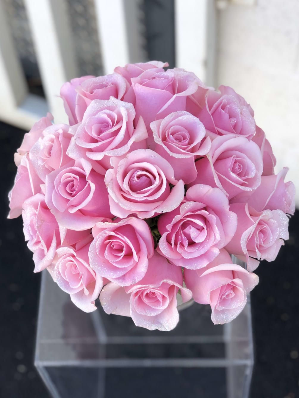 This pink glittered roses arrangement is a great way to add a