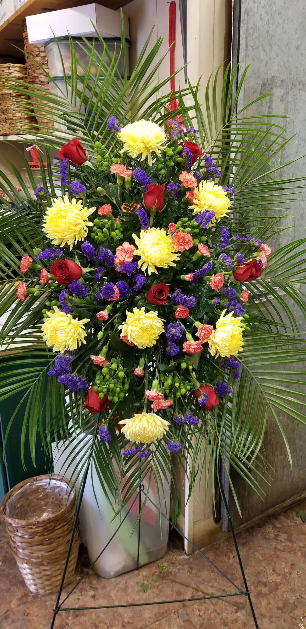 A wonderful combination of yellow, red and purple flowers arranged for a